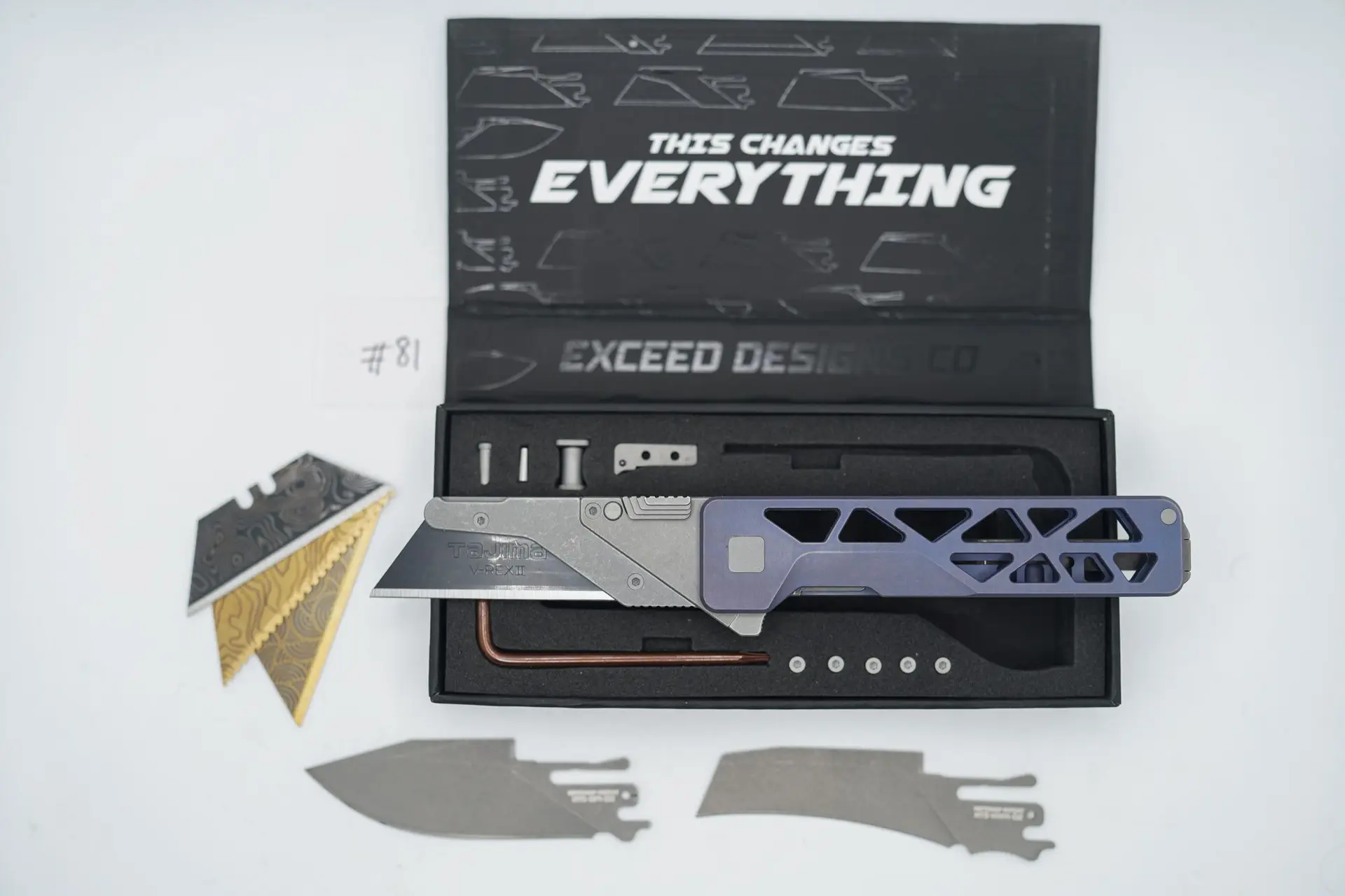 BUILD #81 — Condition 8/10 — TiRant ULTRA Skeleton ‘SKULTRA’ Custom Dark-BLUE Titanium ANO W/Blasted Grey Hardware + Original Box W/Spare Grey Blasted Hardware Kit / Lock Bar insert + D2 Stonewashed Hawkbill Hotswap Blade + D2 Stonewashed Drop Point Hotswap Blade + 3X Custom Laser Engraved Razor Blades