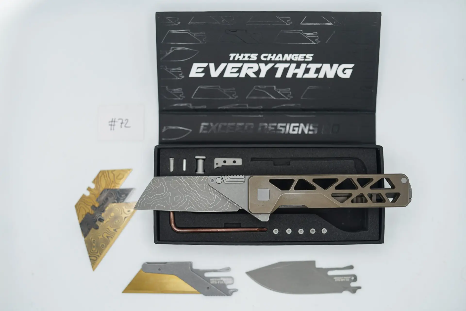 BUILD #72 — Condition 8/10 — TiRant ULTRA Skeleton ‘SKULTRA’ Centurion Bronze W/Blasted Grey Hardware + Original Box W/Spare Grey Blasted Hardware Kit / Lock Bar insert + D2 V2-Topo Sheepsfoot Hotswap Blade + D2 Stonewashed Drop Point Hotswap Blade + 3X Custom Laser Engraved Razor Blades