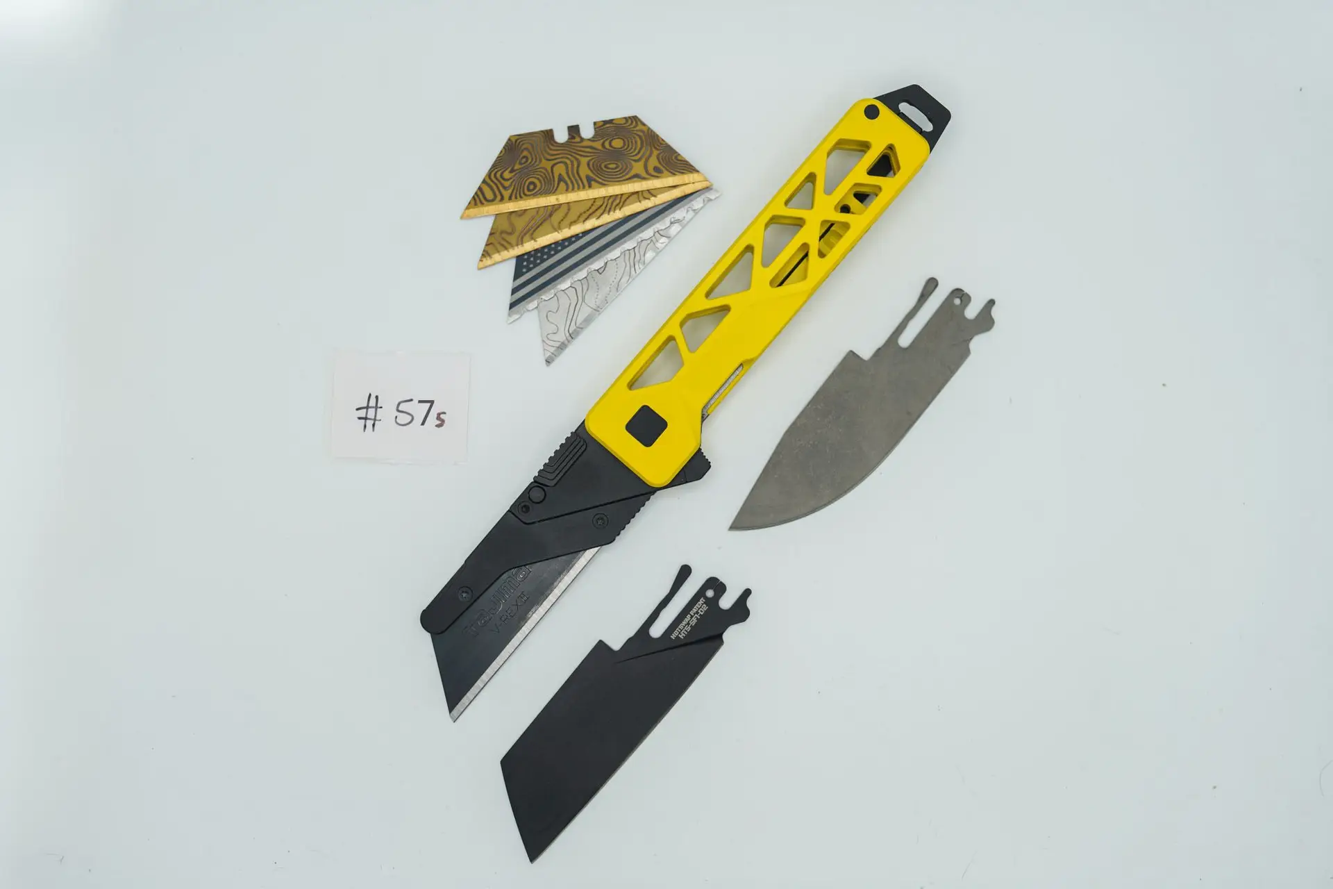 BUILD #57s — Condition 8/10 — TiRant ULTRA – Custom Yellow Cerakote (Blem, See Photos) + Installed SKIFF Bearings + Jet-Black Hardware Kit + Jet-Black Skeleton Pry Bar + D2 Jet-Black Sheepsfoot Hotswap Blade + D2 Stonewashed Drop Point Hotswap Blade + 4X Custom Laser Engraved Razor Blades