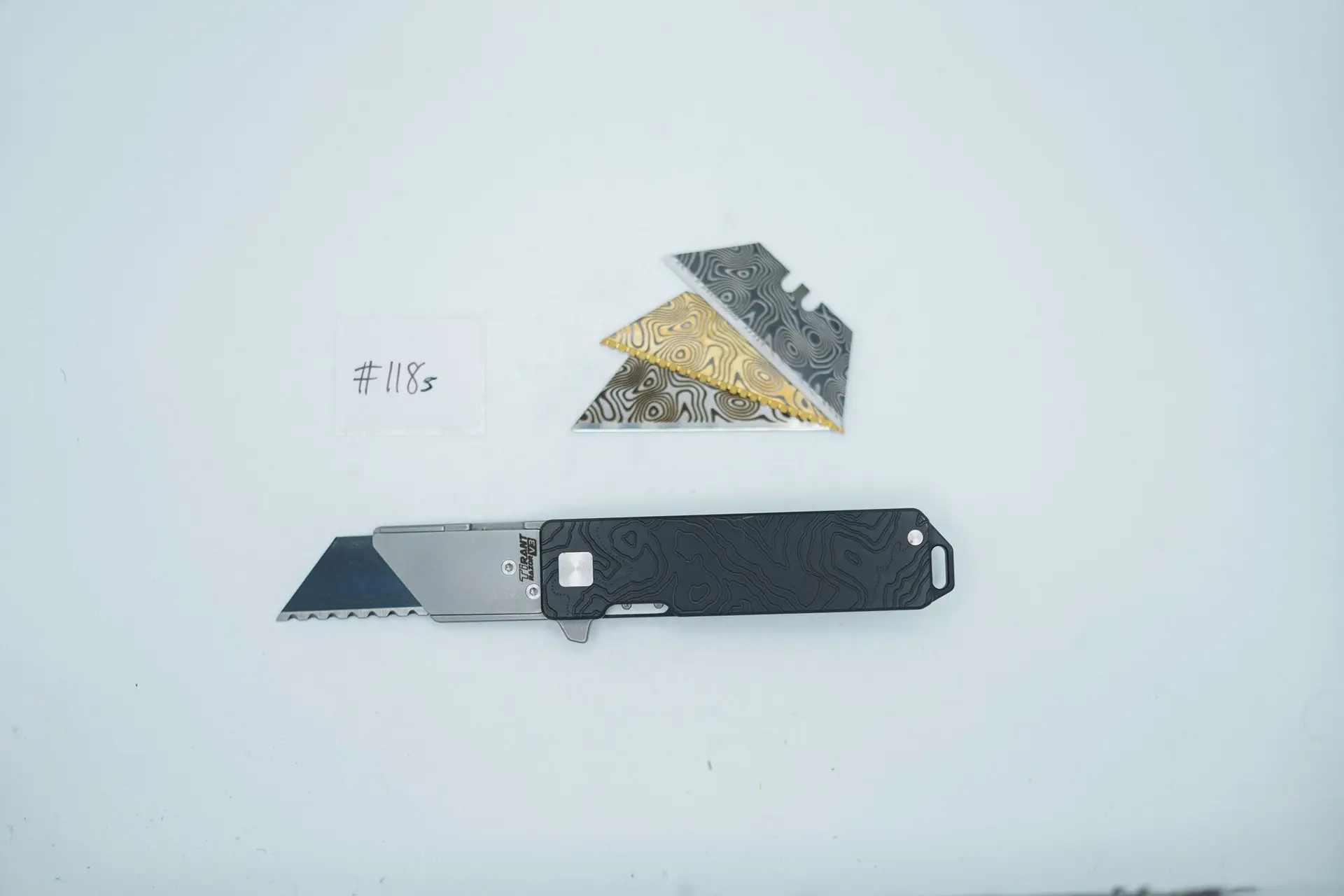 BUILD #118s — Condition 9/10 — TiRant RAZOR V3 Jet-Black PVD Dual-Sided 3D-Milled Cascadia Edition Prototype Laser-Etched + 38MM Mini Clip + Silver Hardware Contrast + Pre-Installed SKIFF Bearings + 4X Custom Laser Engraved Razor Blades From The ToolRoom
