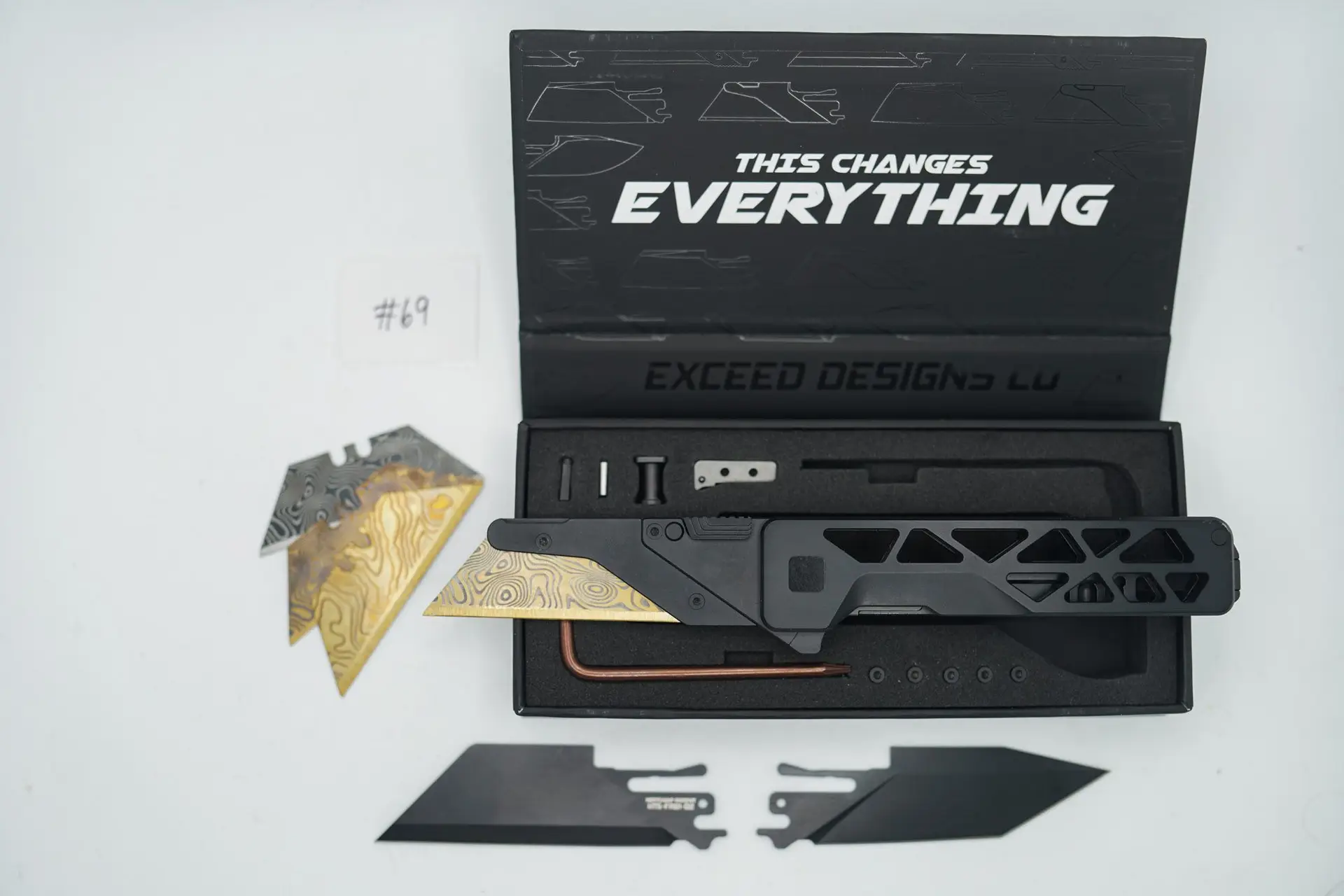 BUILD #69 — Condition 9/10 — TiRant ULTRA Skeleton ‘SKULTRA’ in Jet-Black PVD + Original Box W/Spare Jet-Black PVD Hardware Kit / Lock Bar insert + D2 Jet-Black Tanto Hotswap Blade + D2 Jet-Black Full Razor Hotswap Blade + 4X Custom Laser Engraved Razor Blades